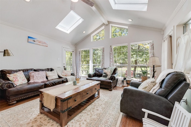 living room with hardwood / wood-style floors, lofted ceiling with beams, ceiling fan, and ornamental molding