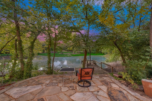 patio terrace at dusk with a water view