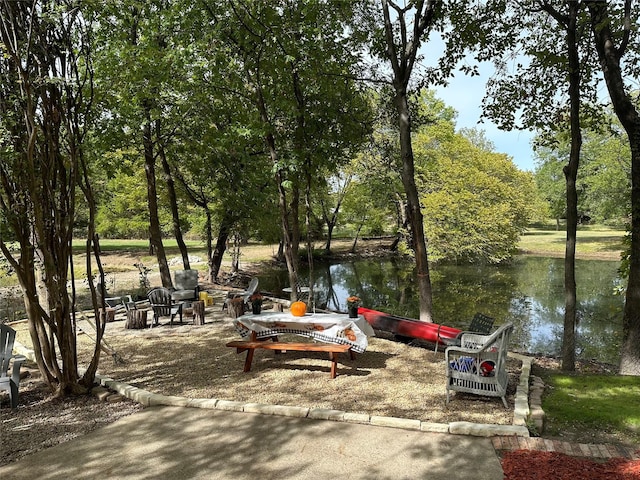 view of patio with a water view