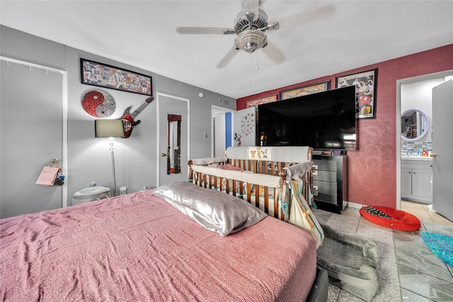 bedroom with ceiling fan and light tile patterned floors