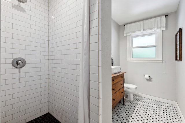 bathroom with vanity, toilet, and a shower with curtain