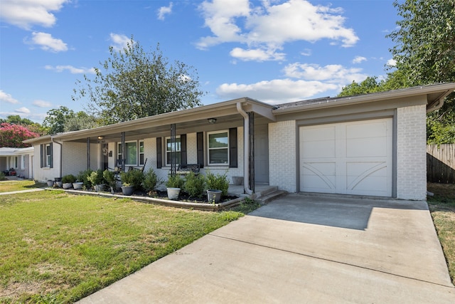 single story home featuring a garage, a front yard, and a porch