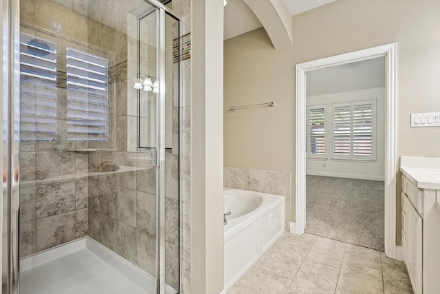 bathroom with tile patterned floors and plus walk in shower