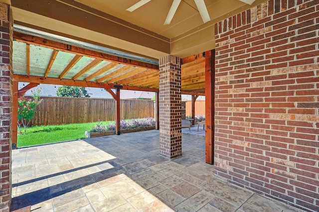 view of patio featuring ceiling fan