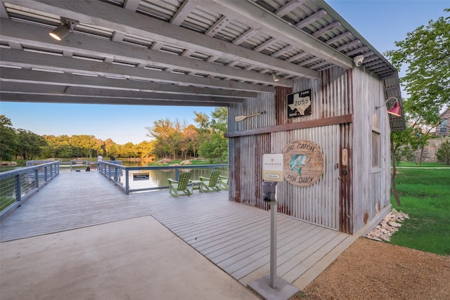 wooden deck featuring a water view