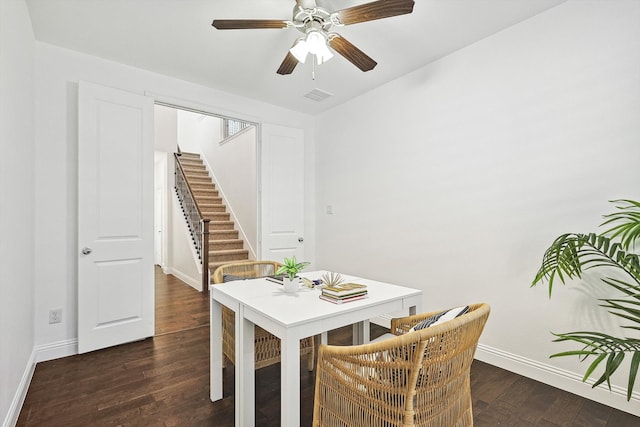 dining space with dark hardwood / wood-style floors and ceiling fan