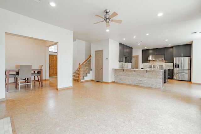 living room featuring ceiling fan