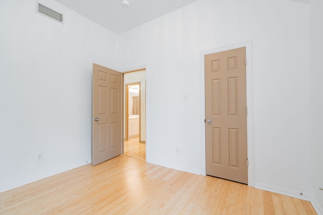 unfurnished room featuring light wood-type flooring