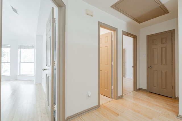 corridor with light hardwood / wood-style flooring