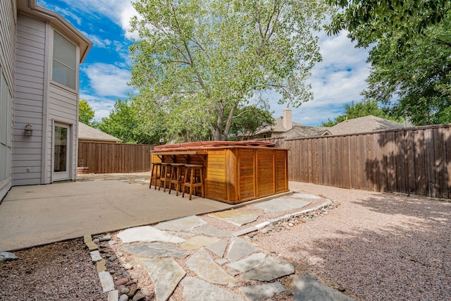 300 Turtle Ct, Mckinney, TX 75072 - view of patio featuring a fenced backyard and outdoor dry bar