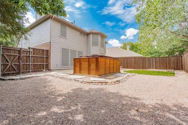 300 Turtle Ct, Mckinney, TX 75072 - rear view of property with a patio, a gate, a chimney, and a fenced backyard