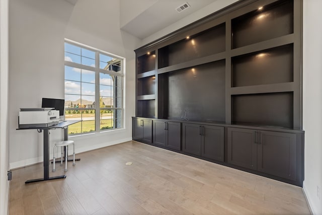 unfurnished office featuring light hardwood / wood-style flooring