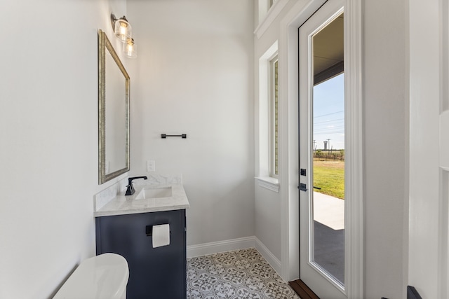 bathroom with vanity and toilet