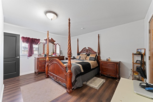 bedroom with dark hardwood / wood-style floors