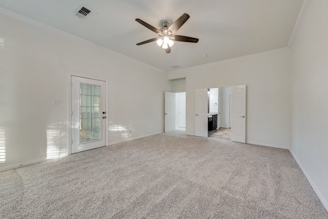 1005 Barre Meadow Ln, Mckinney, TX 75071 - spare room with crown molding, visible vents, baseboards, ceiling fan, and light colored carpet