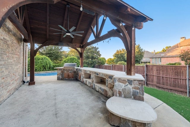 1005 Barre Meadow Ln, Mckinney, TX 75071 - view of patio / terrace with a grill, a gazebo, an outdoor kitchen, ceiling fan, and fence private yard