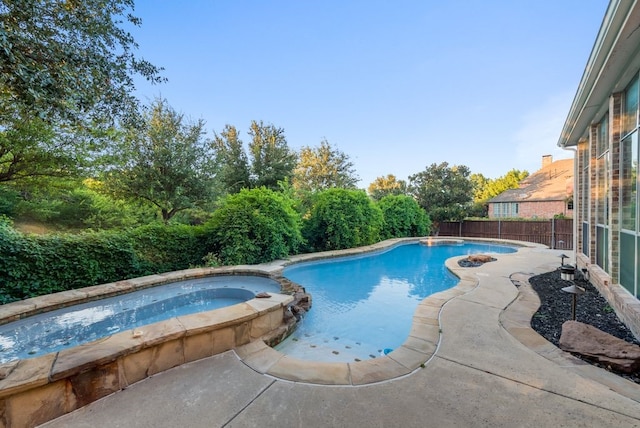 1005 Barre Meadow Ln, Mckinney, TX 75071 - view of swimming pool with a fenced backyard and a pool with connected hot tub