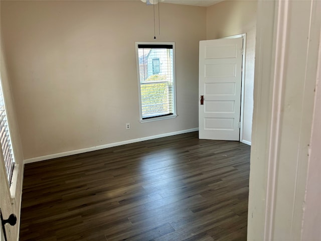 unfurnished room featuring dark hardwood / wood-style flooring