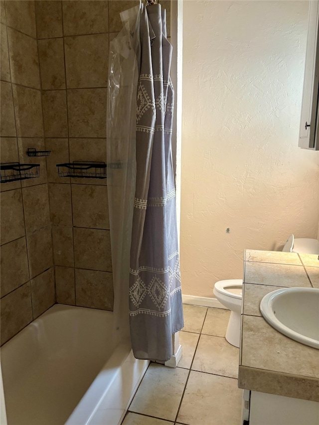 full bathroom with vanity, shower / bath combo with shower curtain, toilet, and tile patterned floors