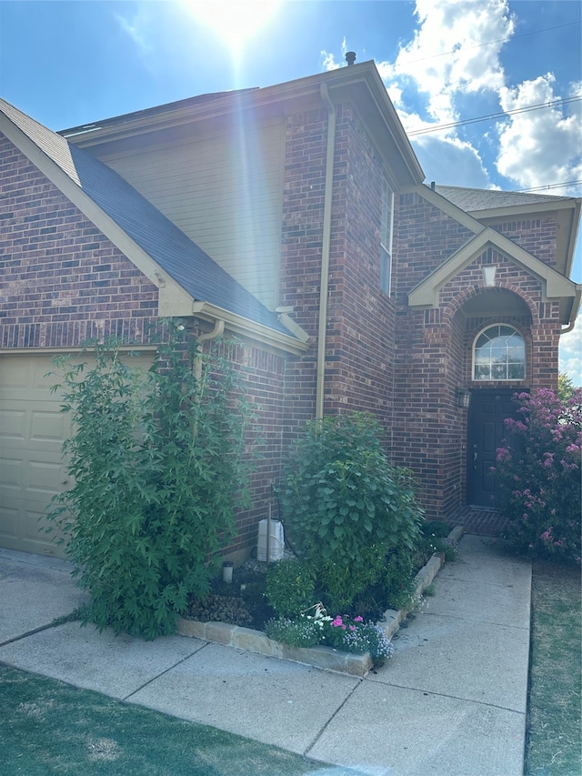 view of side of property featuring a garage