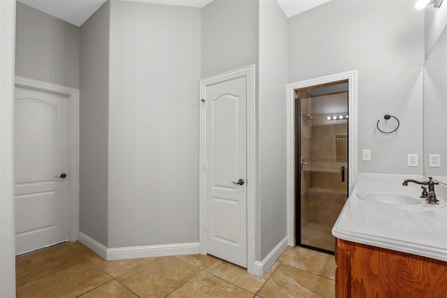 bathroom with vanity, tile patterned floors, and an enclosed shower