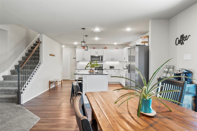 dining area with wood-type flooring