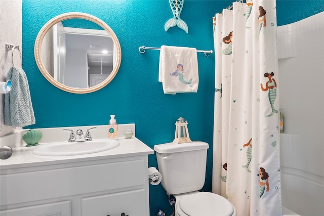 full bathroom with vanity, toilet, and shower / bath combo