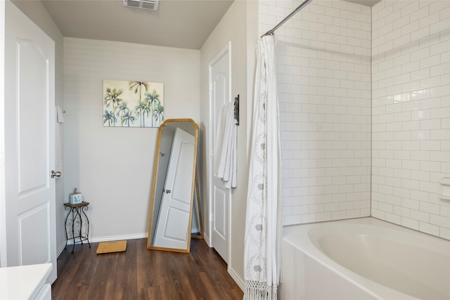 bathroom featuring vanity, shower / bath combo, and hardwood / wood-style flooring