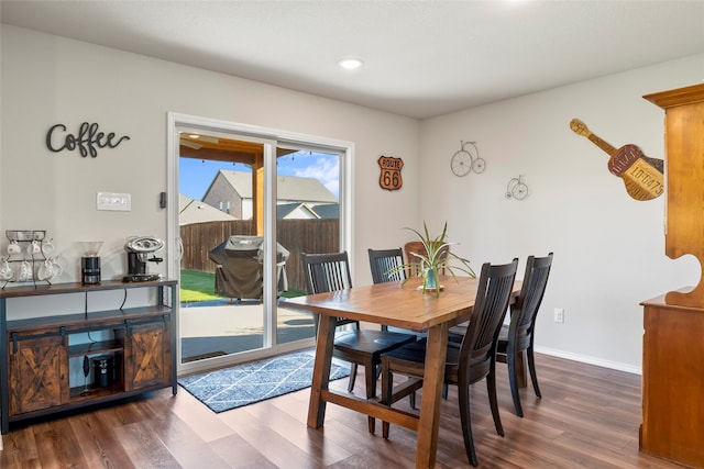 dining room with dark wood-type flooring