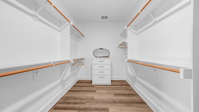 walk in closet featuring hardwood / wood-style floors