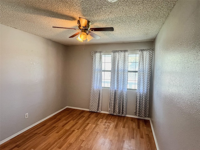 spare room with wood-type flooring, a textured ceiling, and ceiling fan