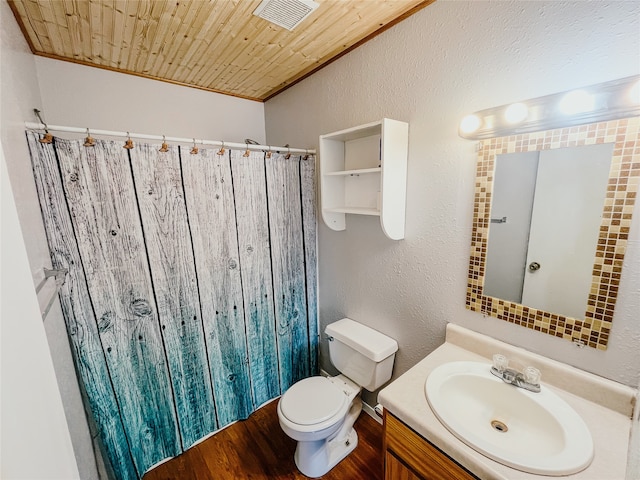 bathroom featuring wood-type flooring, toilet, vanity, wood ceiling, and ornamental molding