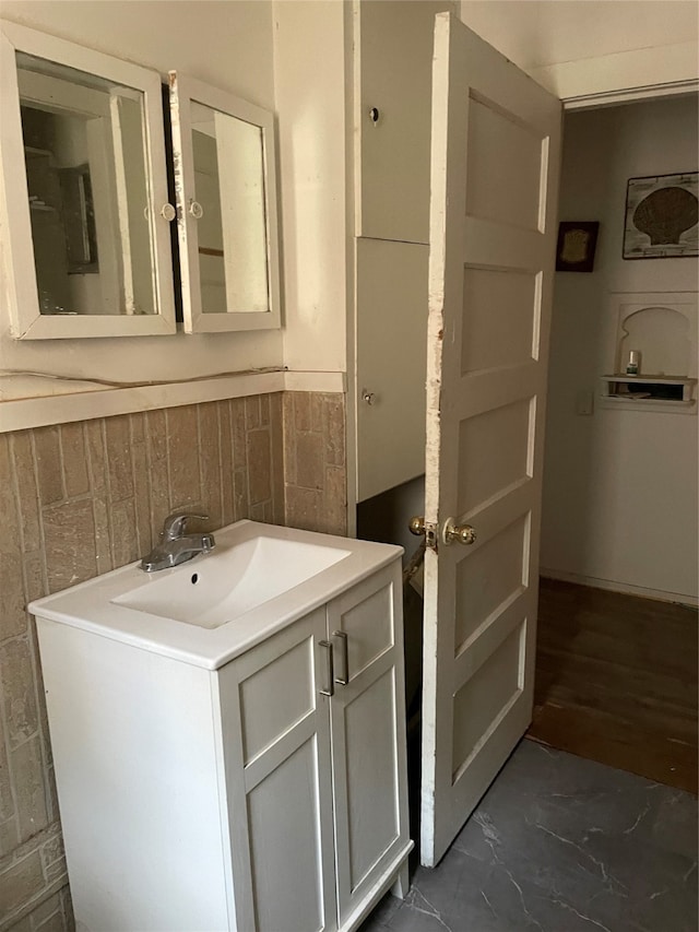 bathroom with vanity and hardwood / wood-style floors