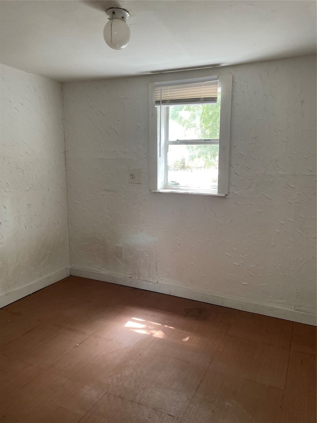 empty room with hardwood / wood-style floors