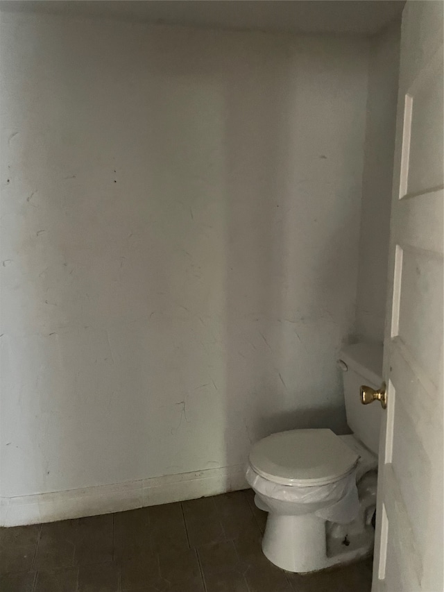 bathroom with tile patterned floors and toilet