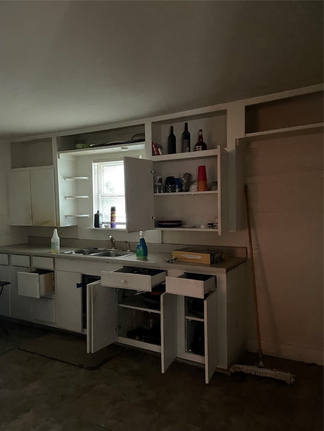 kitchen with sink and white cabinetry