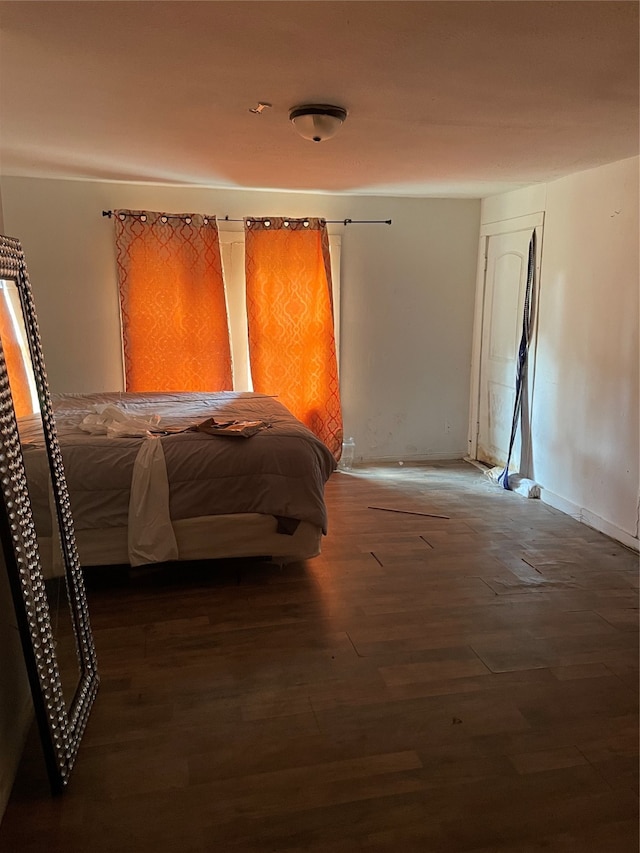 bedroom featuring dark hardwood / wood-style flooring