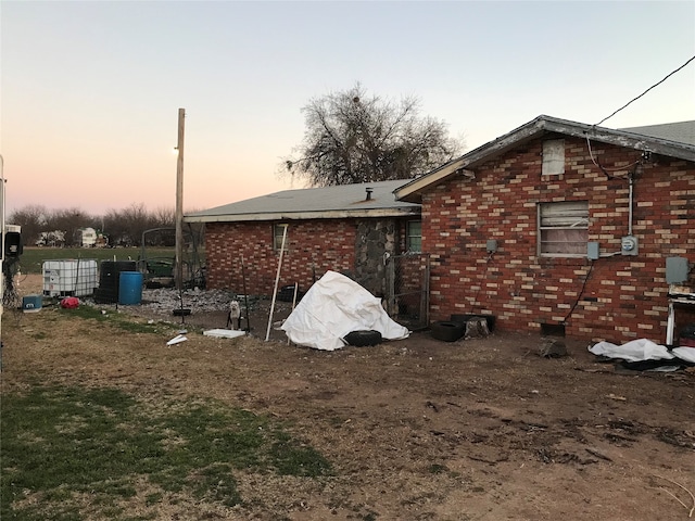 view of property exterior at dusk