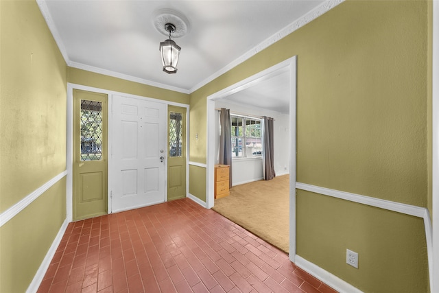 entryway featuring carpet floors and ornamental molding