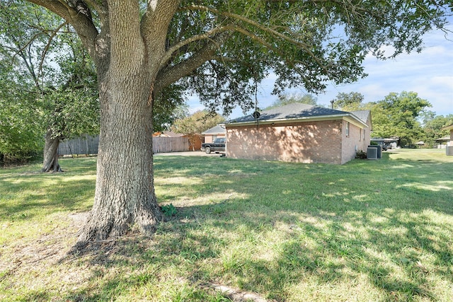 view of yard with central AC