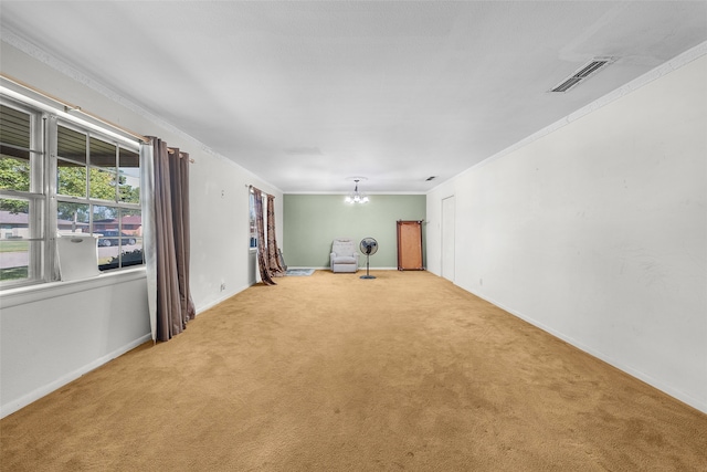 carpeted empty room featuring ornamental molding