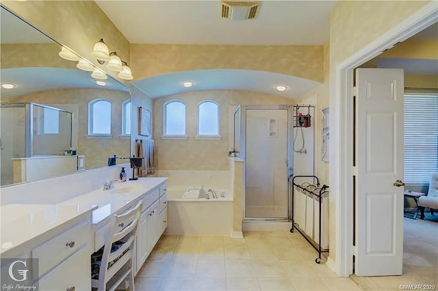 bathroom featuring independent shower and bath and vanity