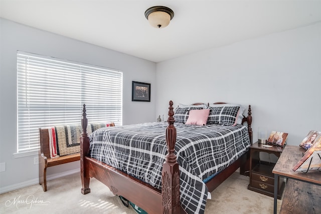 carpeted bedroom featuring multiple windows