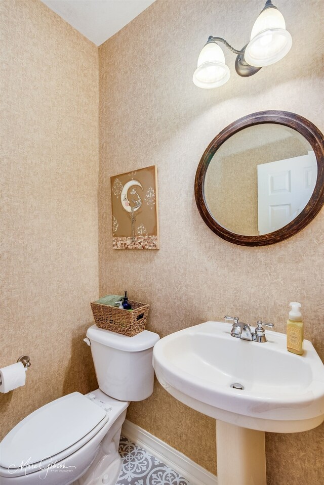 bathroom with toilet and sink