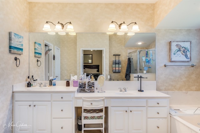 bathroom featuring vanity and separate shower and tub