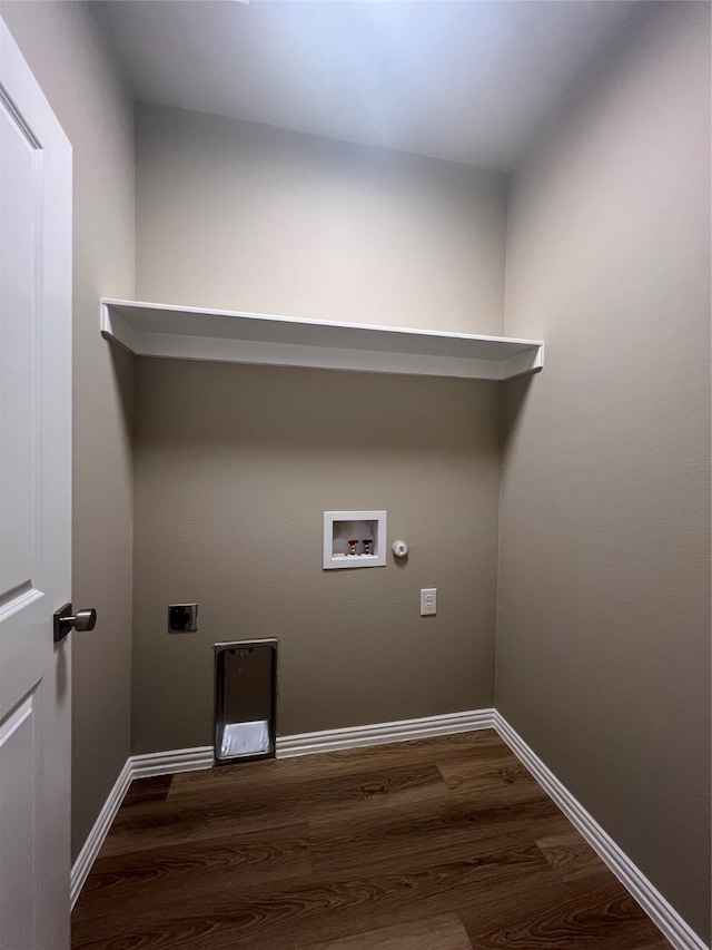 washroom with gas dryer hookup, dark hardwood / wood-style flooring, washer hookup, and hookup for an electric dryer