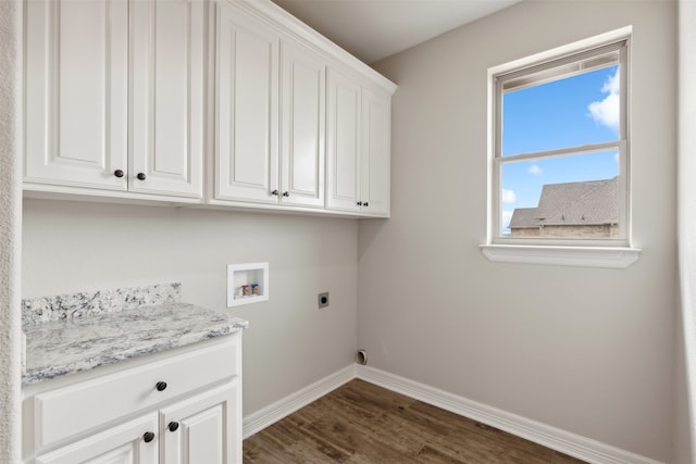 washroom with washer hookup, cabinets, dark hardwood / wood-style floors, and electric dryer hookup