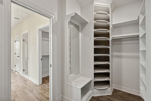 spacious closet featuring hardwood / wood-style flooring