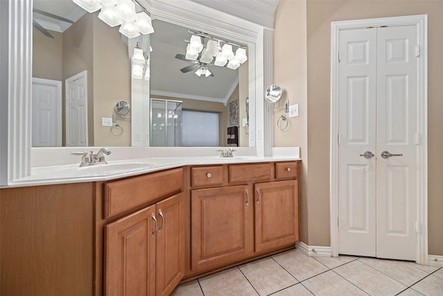 bathroom with crown molding, vanity, ceiling fan, and tile patterned floors