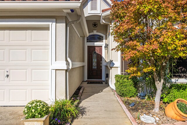 entrance to property featuring a garage